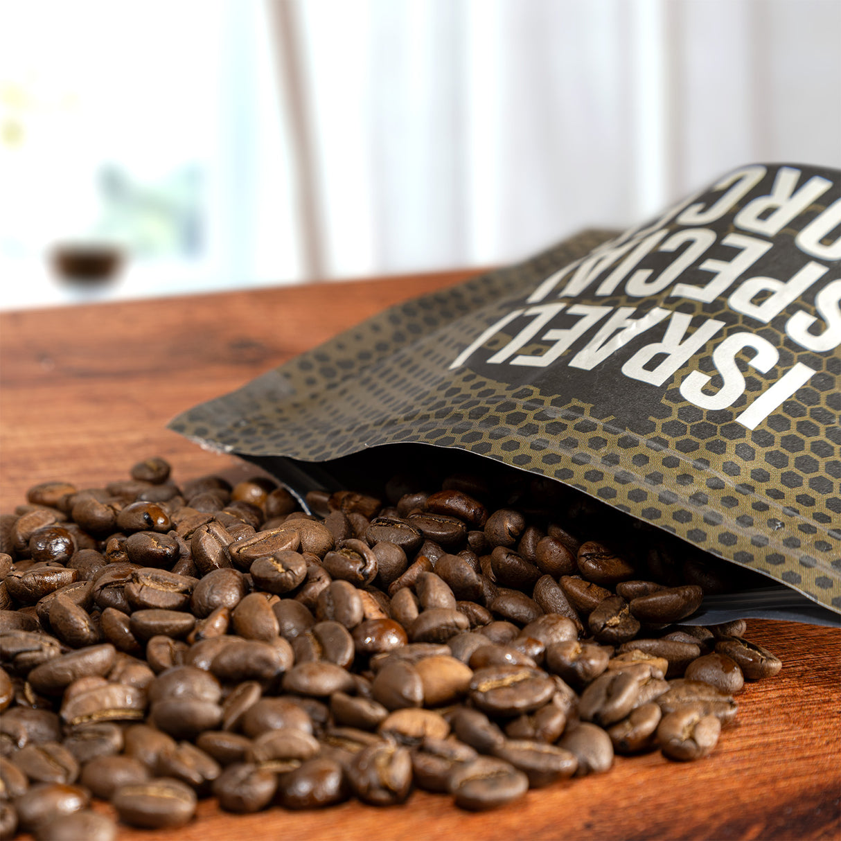 Open bag of coffee beans on a wooden surface with a blurred background